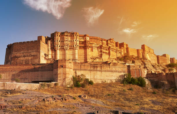 Explore Jodhpur with the Best Cab Service panoramic view of Mehrangarh Fort against a clear blue sky, showcasing its majestic sandstone architecture.