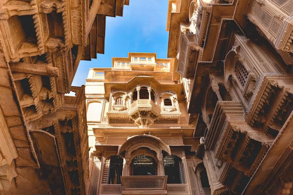 Intricately carved sandstone facade and balconies of Patwon Ki Haveli in Jaisalmer, Rajasthan.
