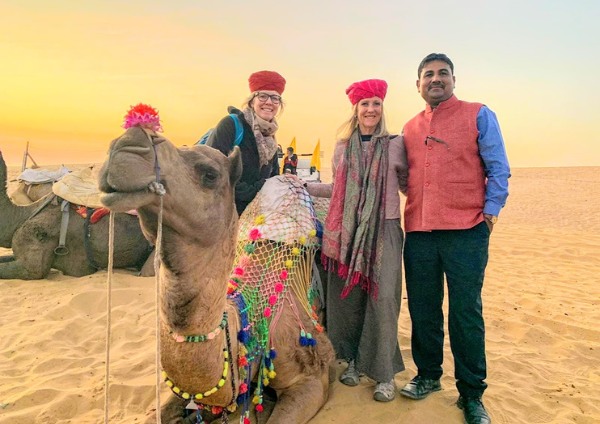 Golden sand dunes and camels at sunset in Sam Sand Dunes, Jaisalmer. Jodhpur to Jaisalmer cab