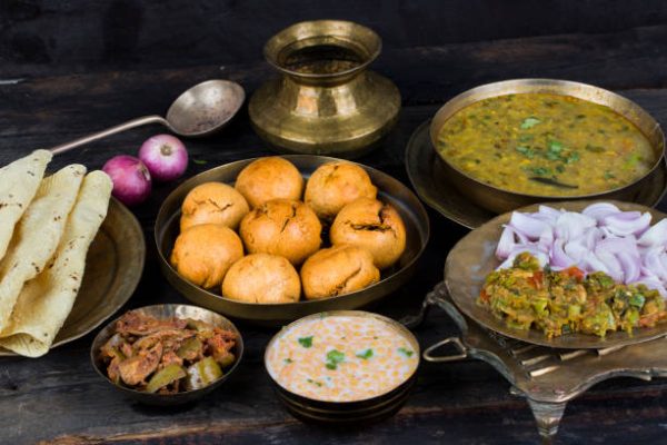 Savor traditional Rajasthani dishes like dal baati churma and gatte ki sabzi.