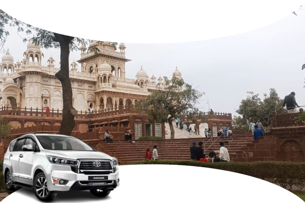 A yellow and black tourist taxi driving through Jodhpur with Mehrangarh Fort and blue city houses in the background, perfect for sightseeing.