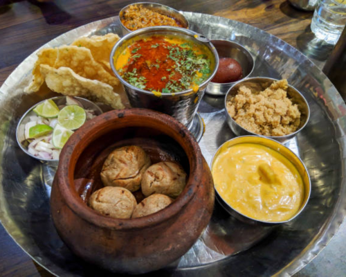 Traditional Rajasthani thali enjoyed during a Jodhpur to Nakoda Ji road trip
