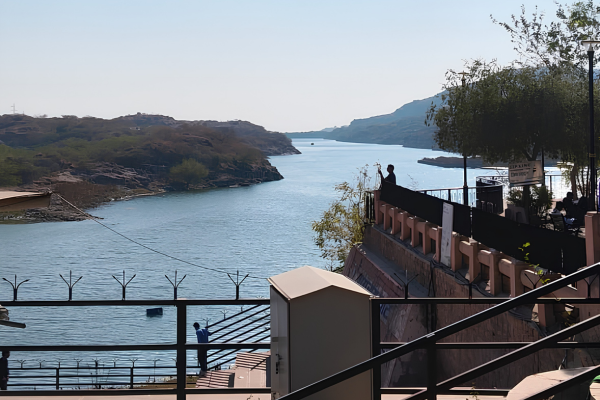 Scenic view of Kaylana Lake with hills and waterfront in Jodhpur.