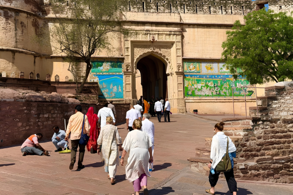 Mehrangarh Fort entrance in Jodhpur with visitors walking towards the historic fort.