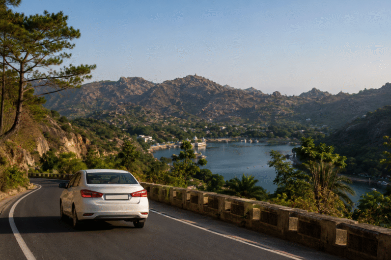 Jodhpur to Mount Abu road trip with a white sedan driving through scenic Aravalli hills overlooking Nakki Lake, showcasing the natural beauty and hill station landscape of Mount Abu, Rajasthan.
