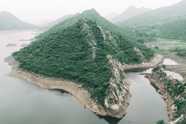 Bahubali Hills in Udaipur in Monsoon overlooking the serene Badi Lake with misty clouds