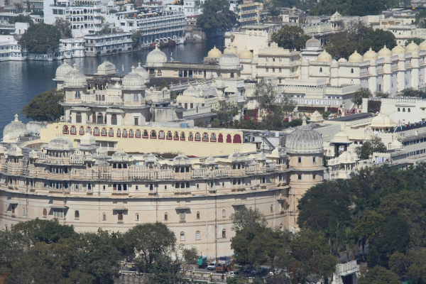 City Palace in Udaipur in Monsoon with rain-soaked royal architecture and lush surroundings