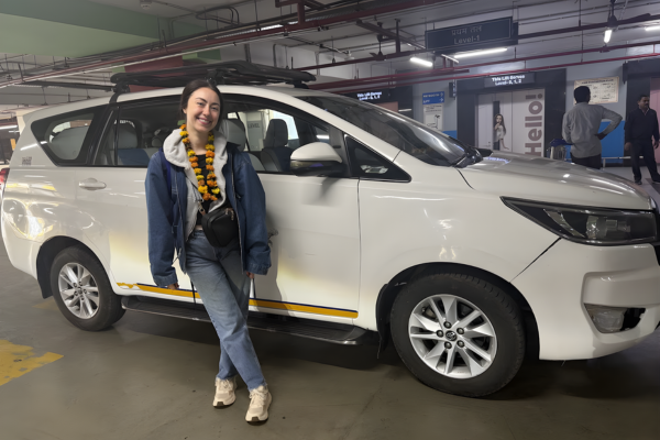 Female Travel in India with private car showing a solo woman traveler enjoying a safe and comfortable journey