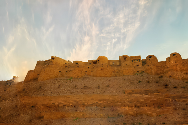 Bus Rental Jodhpur to Jaisalmer visitors exploring the historic Jaisalmer Fort in Rajasthan