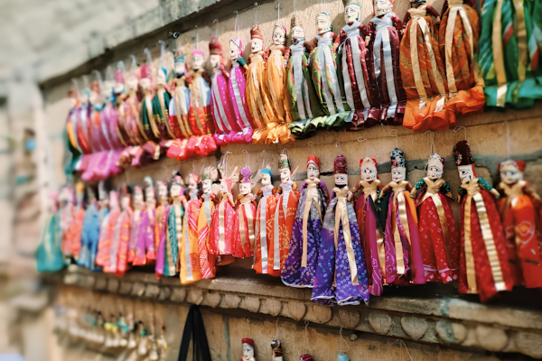 Bus Rental Jodhpur to Jaisalmer visitors shopping in colorful local markets of Jaisalmer
