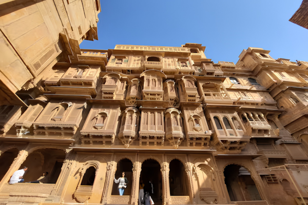 Bus Rental Jodhpur to Jaisalmer tourists visiting the magnificent Patwon Ki Haveli in Jaisalmer