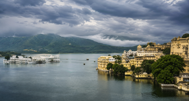 Udaipur Lake Pichola and City Palace during monsoon with cloudy Aravalli hills