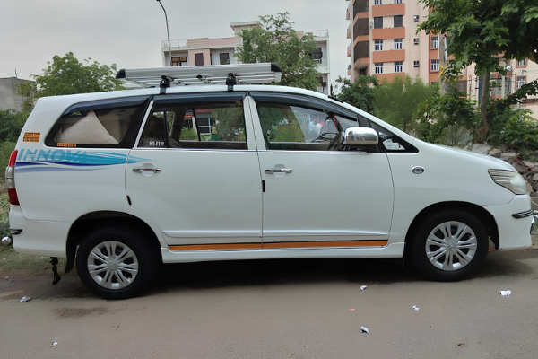 White Toyota Innova available for tourist travel and group transportation.