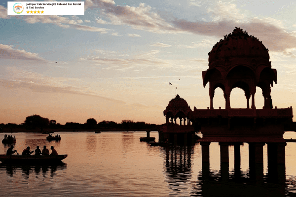 Cab Hire Service Jaisalmer, Serene view of Gadisar Lake with heritage temples and boats