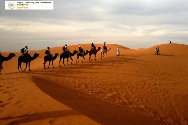 Cab Hire Service Jaisalmer, Peaceful landscape of Khuri Dunes with a camel in the background