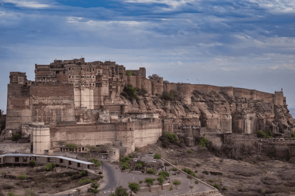 Mehrangarh Fort standing tall on a hill with massive walls and intricate architecture Taxi Service in Jodhpur.